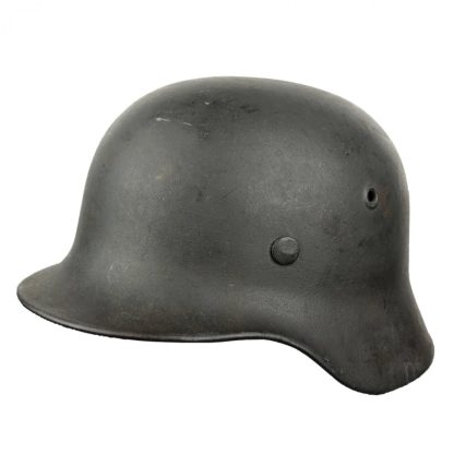 Original WWII German M40 ND helmet with battle damage