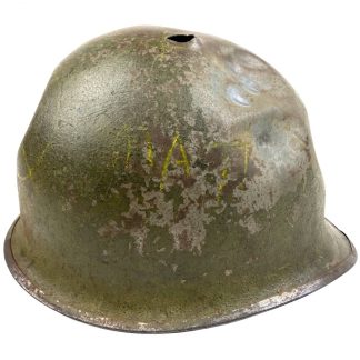 Original WWII US M1 helmet with battle damage