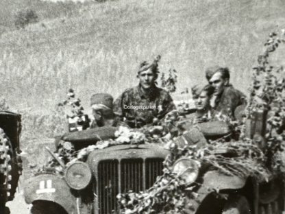 Original WWII German photo of Waffen-SS soldiers passing a disabled Churchill tank
