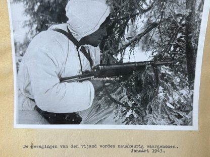 Original WWII German photo of a German soldier in winter camouflage clothing with MP40