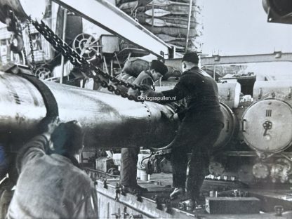 Original WWII German photo of torpedoes are pushed into the launch tubes