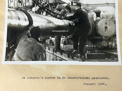 Original WWII German photo of torpedoes are pushed into the launch tubes