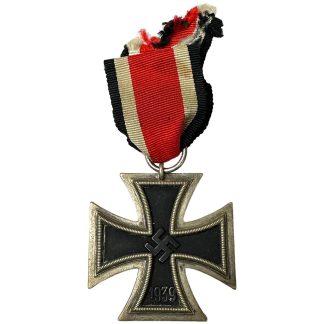"High-resolution photograph showcasing the iconic German Iron Cross medal, distinguished by its bold black cross design against a gleaming silver or bronze backdrop, symbolizing honor, valor, and military prowess within German history and culture."