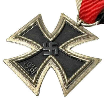 ChatGPT "High-resolution image of the revered German Iron Cross medal, showcasing its iconic design with a prominent black cross encased within a silver or gold frame, symbolizing bravery, valor, and honor in military service."