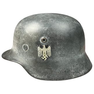 This is a German M40 (Heer) helmet with winter camouflage paint, also called White Wash. The helmet features one decal.
