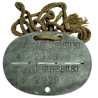 This is a German "Erkennungsmarke" also known as a dog tag which was worn by a soldier of the Grenadier-Ersatz-Bataillon 80 during World War II.