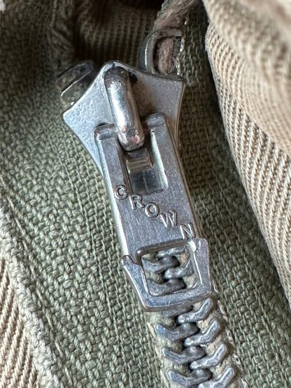 This is a Crown Zipper on a US WWII M42 airborne jump smock.