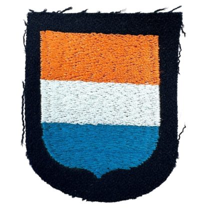 Emblem (sleeve shield) produced at Dachau concentration camp for Dutch volunteers in the Waffen-SS, depicting the Orange-White-Blue prince's flag on a black wool background.