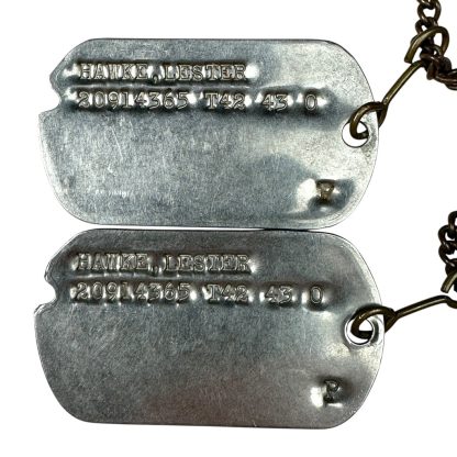 Original WWII US dog tags with four-leaf clover