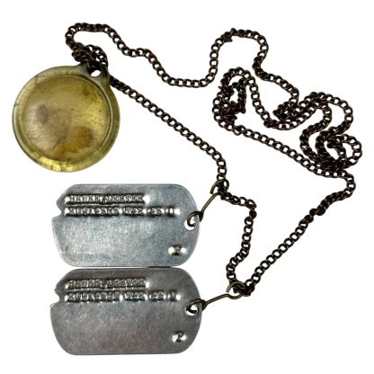 Original WWII US dog tags with four-leaf clover