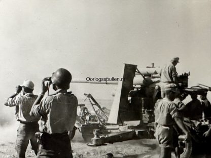 Flak 88 in action against Allied tanks in Africa. Photo comes from the Erwin Rommel photo albums.