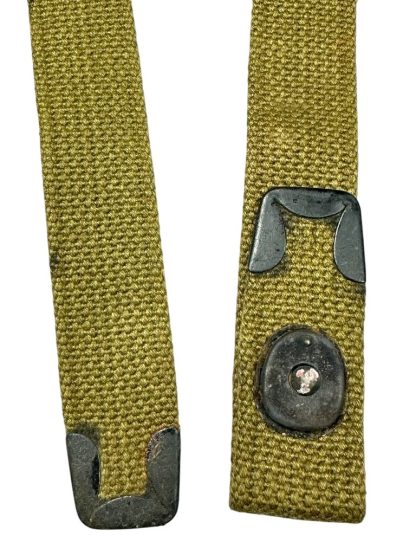 Olive green rifle sling for the American M1 Carbine, used during World War II, featuring a metal buckle and adjustable fastening.