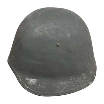 A WWII Danish M23/41 military helmet with a steel construction and a dark gray finish. The design features a rounded crown and a slightly flared brim for added protection. The surface shows light scratches and signs of wear, with a single central rivet visible at the front, indicating its attachment point for the internal liner.