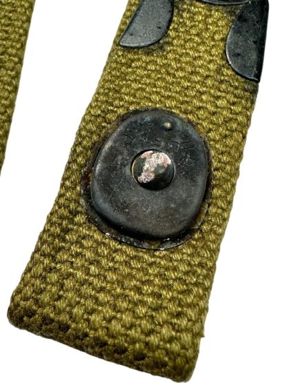 Olive green rifle sling for the American M1 Carbine, used during World War II, featuring a metal buckle and adjustable fastening.