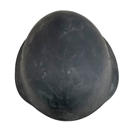 A WWII Danish M23/41 military helmet with a steel construction and a dark gray finish. The design features a rounded crown and a slightly flared brim for added protection. The surface shows light scratches and signs of wear, with a single central rivet visible at the front, indicating its attachment point for the internal liner.