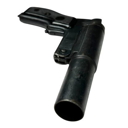 Russian SPSh-44 flare gun from World War II, constructed from black metal with a distinctive cylindrical barrel and ergonomic grip, preserved in original condition as a historical artifact.