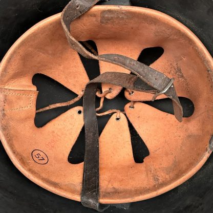 A WWII Danish M23/41 military helmet with a steel construction and a dark gray finish. The design features a rounded crown and a slightly flared brim for added protection. The surface shows light scratches and signs of wear, with a single central rivet visible at the front, indicating its attachment point for the internal liner.