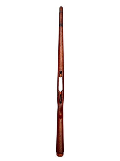 A vintage wooden rifle stock for a German WWII Mauser K98, showcasing a polished reddish-brown finish with visible wood grain texture. The design features a curved grip and cutouts for mounting hardware. The stock appears well-preserved with signs of age and use, such as minor scuffs and wear, adding to its historical authenticity.