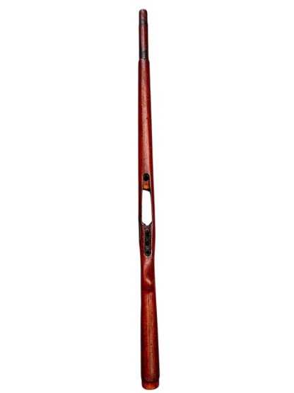 A vintage wooden rifle stock for a German WWII Mauser K98, showcasing a polished reddish-brown finish with visible wood grain texture. The design features a curved grip and cutouts for mounting hardware. The stock appears well-preserved with signs of age and use, such as minor scuffs and wear, adding to its historical authenticity.