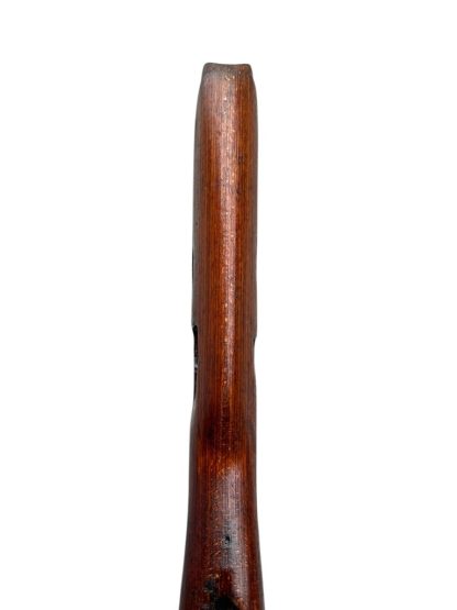 German WWII Mauser K98 wooden rifle stock, showcasing a rich reddish-brown wood finish with visible wear and aging, featuring the characteristic design for a bolt-action rifle. The stock includes a cutout for the bolt mechanism and a recess for the magazine well, highlighting its historical craftsmanship.