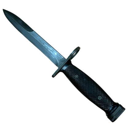 This is an image of a bayonet, specifically the M7 bayonet. It was originally designed to be mounted on the M16 rifle and is a product of the U.S. military's development. The M7 features a sharp blade with a fuller and is designed for utility and combat purposes. Its handle typically has a textured grip, and the design includes a guard and attachment mechanism for the rifle.