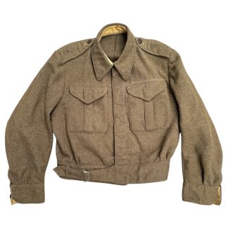 A vintage 1941 Canadian Battle Dress jacket in brown wool, featuring two chest pockets with buttoned flaps, a fold-down collar, epaulets with buttons on the shoulders, and a belted waist. The jacket has a cropped fit, long sleeves with buttoned cuffs, and a partially visible beige lining. The fabric appears thick and durable, characteristic of World War II military uniforms.