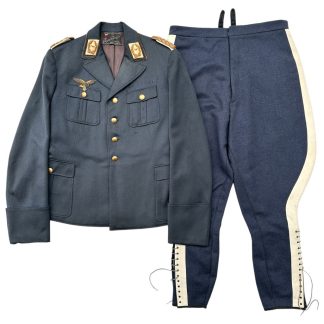 WWII German Luftwaffe General's uniform, consisting of a dark blue-gray tunic with gold buttons, gold-embroidered shoulder boards, and a gold-braided breast eagle insignia, paired with matching riding breeches featuring white piping and lace-up cuffs.