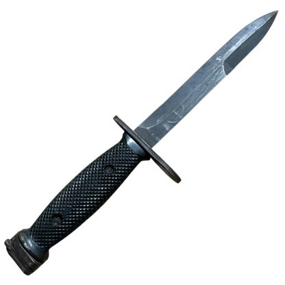 This is an image of a bayonet, specifically the M7 bayonet. It was originally designed to be mounted on the M16 rifle and is a product of the U.S. military's development. The M7 features a sharp blade with a fuller and is designed for utility and combat purposes. Its handle typically has a textured grip, and the design includes a guard and attachment mechanism for the rifle.