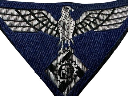 WWII German Technische Nothilfe (TeNo) cap insignia featuring an eagle clutching a cogwheel with a swastika at its center, embroidered in silver or gray on a dark backing, used by the Technical Emergency Corps.