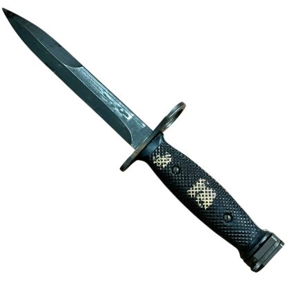 This is an image of a bayonet, specifically the M7 bayonet. It was originally designed to be mounted on the M16 rifle and is a product of the U.S. military's development. The M7 features a sharp blade with a fuller and is designed for utility and combat purposes. Its handle typically has a textured grip, and the design includes a guard and attachment mechanism for the rifle.