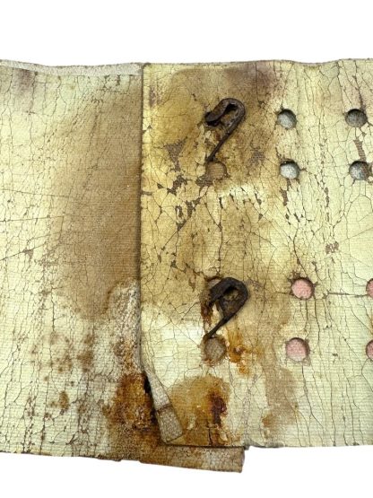 A worn and aged WWII US Airborne invasion armband featuring a faded American flag design with 48 stars, printed on a yellowed fabric background with visible cracks and creases.