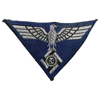 WWII German Technische Nothilfe (TeNo) cap insignia featuring an eagle clutching a cogwheel with a swastika at its center, embroidered in silver or gray on a dark backing, used by the Technical Emergency Corps.