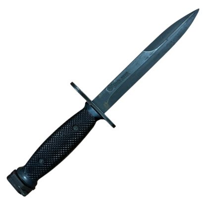 This is an image of a bayonet, specifically the M7 bayonet. It was originally designed to be mounted on the M16 rifle and is a product of the U.S. military's development. The M7 features a sharp blade with a fuller and is designed for utility and combat purposes. Its handle typically has a textured grip, and the design includes a guard and attachment mechanism for the rifle.