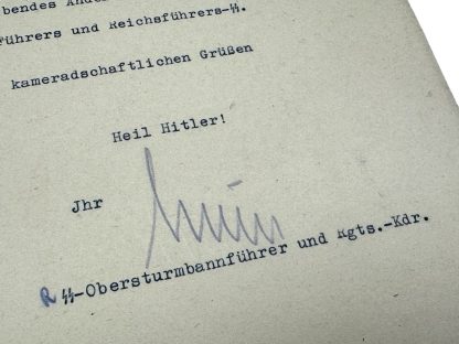 Authentic WWII-era autograph of SS-Brigadeführer Hinrich Schuldt on an official Nazi document. Signed by Schuldt as an SS-Obersturmbannführer and battalion commander, featuring the ‘Heil Hitler’ salutation and typed SS designation. Rare Third Reich military signature, Waffen-SS historical artifact, and German World War II memorabilia.