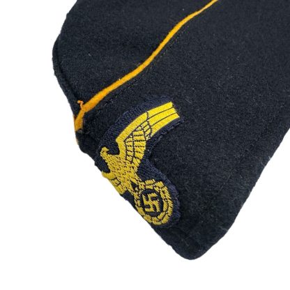 Kriegsmarine female overseas cap – WWII German Navy women's side cap with yellow piping and insignia, authentic military headgear.