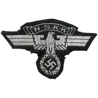 Original WWII German NSKK flatwire sleeve eagle insignia, featuring a silver eagle with outstretched wings clutching a swastika, with 'NSKK' text above. Embroidered on black cloth, showing signs of wear and fraying.