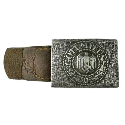 A German WWII Wehrmacht Heer belt buckle with a leather tab, manufactured by Overhoff & Cie. The rectangular aluminum buckle features a raised design with the German eagle clutching a swastika, encircled by a wreath and the inscription 'GOTT MIT UNS.' The leather tab shows signs of aging and wear.