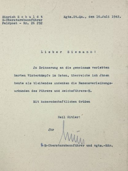 Authentic WWII-era autograph of SS-Brigadeführer Hinrich Schuldt on an official Nazi document. Signed by Schuldt as an SS-Obersturmbannführer and battalion commander, featuring the ‘Heil Hitler’ salutation and typed SS designation. Rare Third Reich military signature, Waffen-SS historical artifact, and German World War II memorabilia.