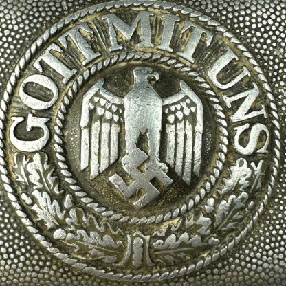 Original WWII German WH Heer EM/NCO belt buckle – aluminum construction featuring Wehrmacht eagle with swastika and 'Gott Mit Uns' inscription.