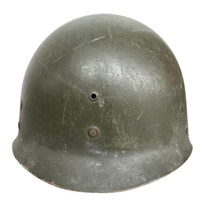 WWII-era US Airborne M1C helmet liner manufactured by Westinghouse, featuring an olive drab finish with visible wear, ventilation holes, and a textured surface. The liner was designed for paratroopers and used in combination with the M1C helmet for added protection and comfort.