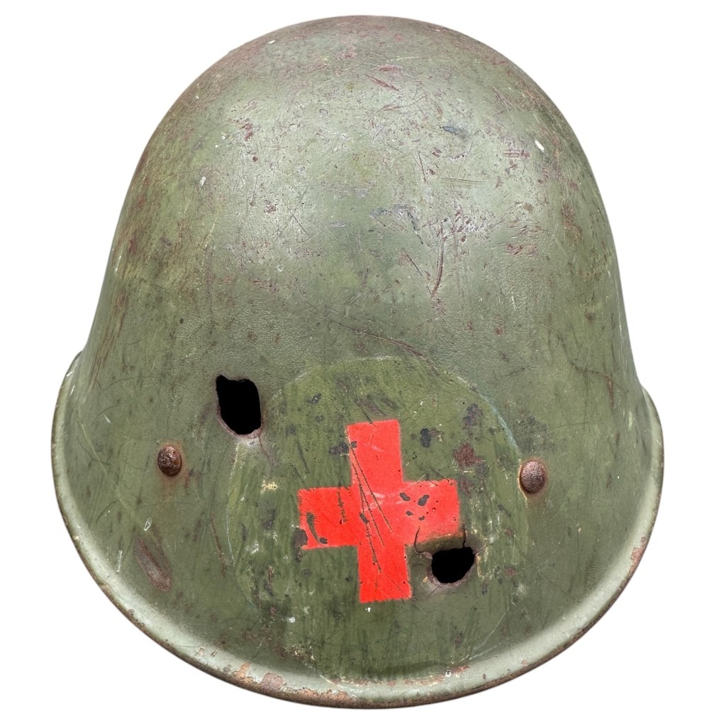 Original WWII Dutch Red Cross helmet with bullet holes