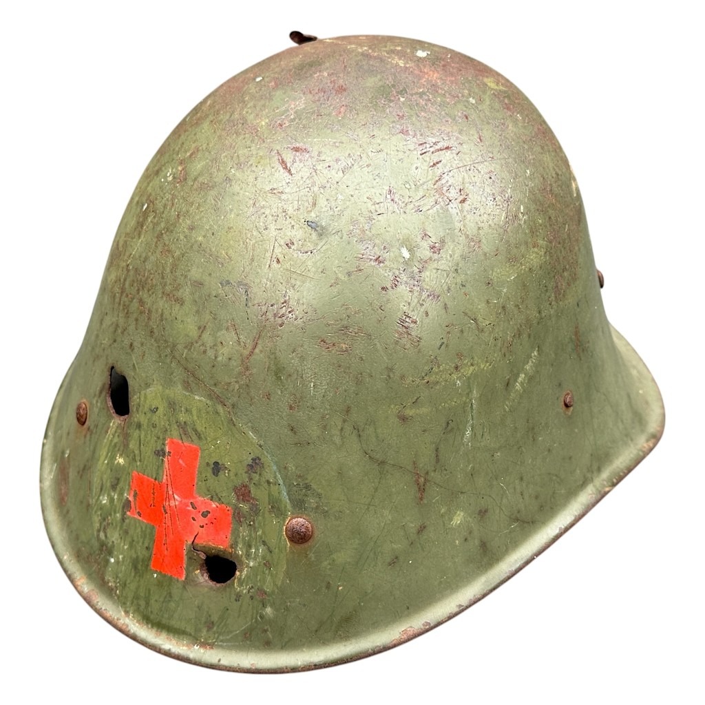 Original WWII Dutch Red Cross helmet with bullet holes