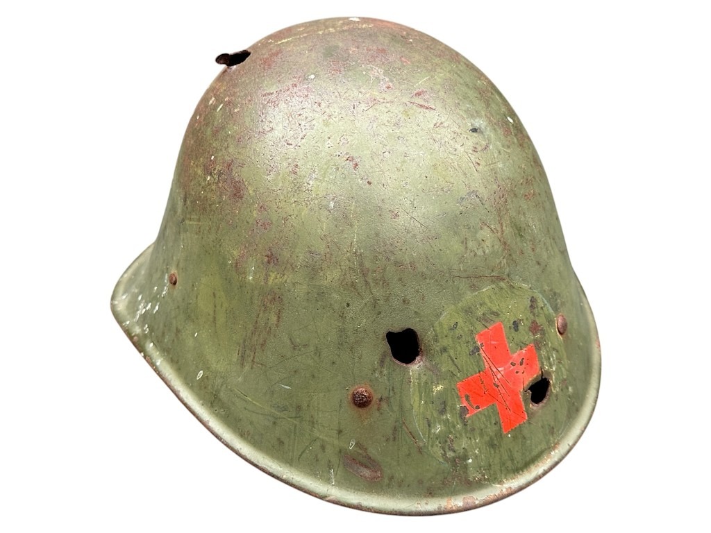 Original WWII Dutch Red Cross helmet with bullet holes