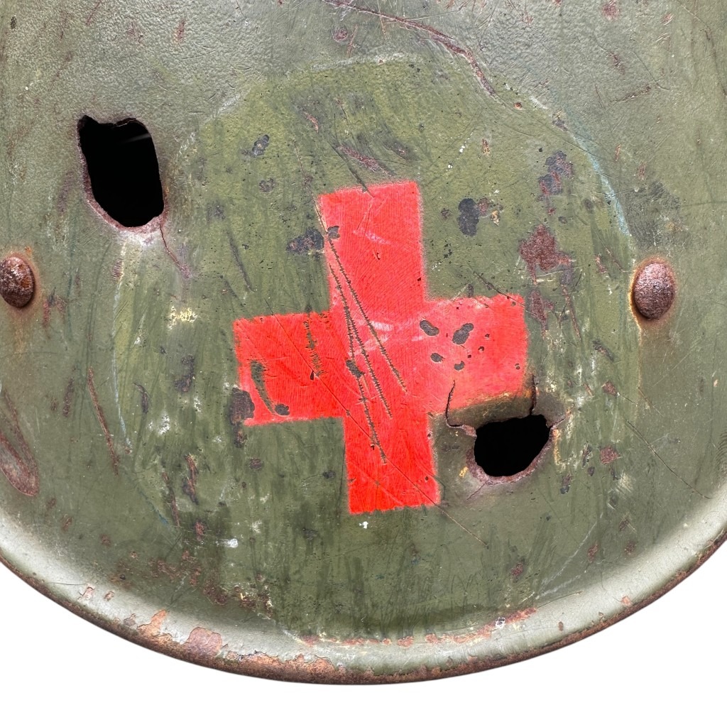 Original WWII Dutch Red Cross helmet with bullet holes