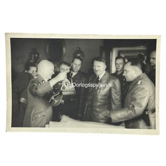 Historic WWII photo of Adolf Hitler with high-ranking Nazi officers examining a sculpture—valuable reference for militaria collectors and WWII historians, with visible uniforms, insignia, and ceremonial context.