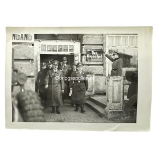 Rare WWII photo of Adolf Hitler exiting the ‘Der Linzer Hof’ hotel in Linz with SS officers—valuable for collectors of Third Reich memorabilia, showing original uniforms, architecture, and historical context.