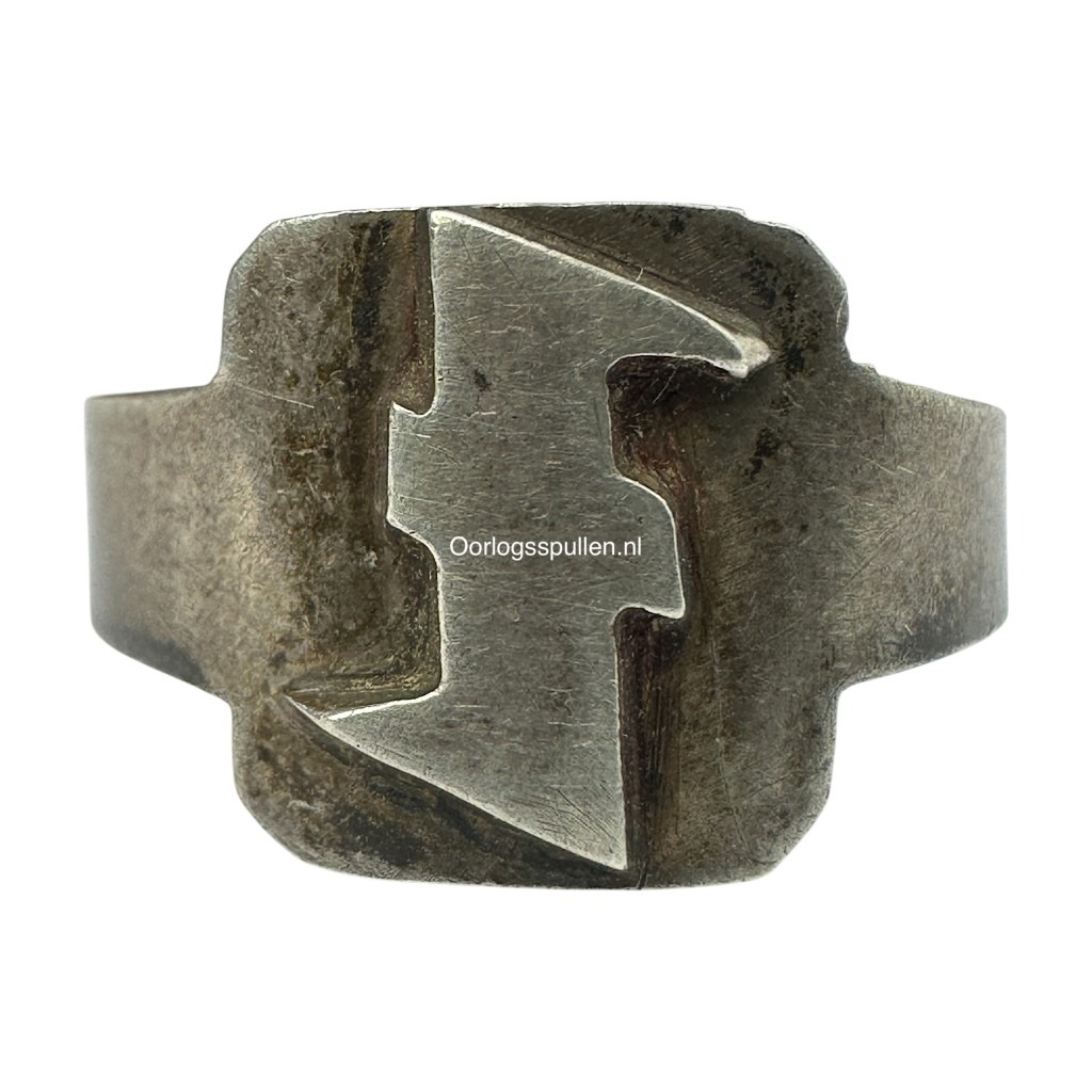 Original WWII Dutch collaboration ring featuring raised Wolfsangel symbol, used by Dutch SS and NSB W.A. rare wartime artifact highly sought after by militaria and collaboration collectors.