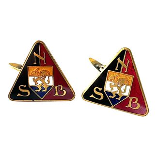Original 1930s–1940s NSB cufflinks featuring the iconic triangular logo in black, red, and gold, with the Dutch lion and the letters N, S, and B – rare WWII-era historical collectible.