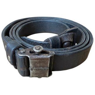 Original World War II German Mauser K98 leather rifle sling, complete with metal clasp and original patina, ideal for military collectors.