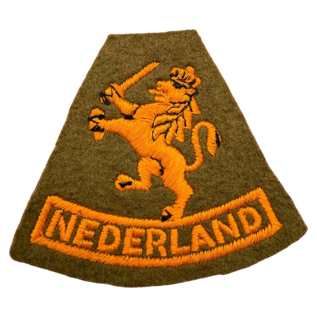 Original WWII Dutch Princess Irene Brigade insignia, 1944 England-made uniform patch with orange Dutch lion and 'Nederland' text, rare World War Two Allied militaria collectible.